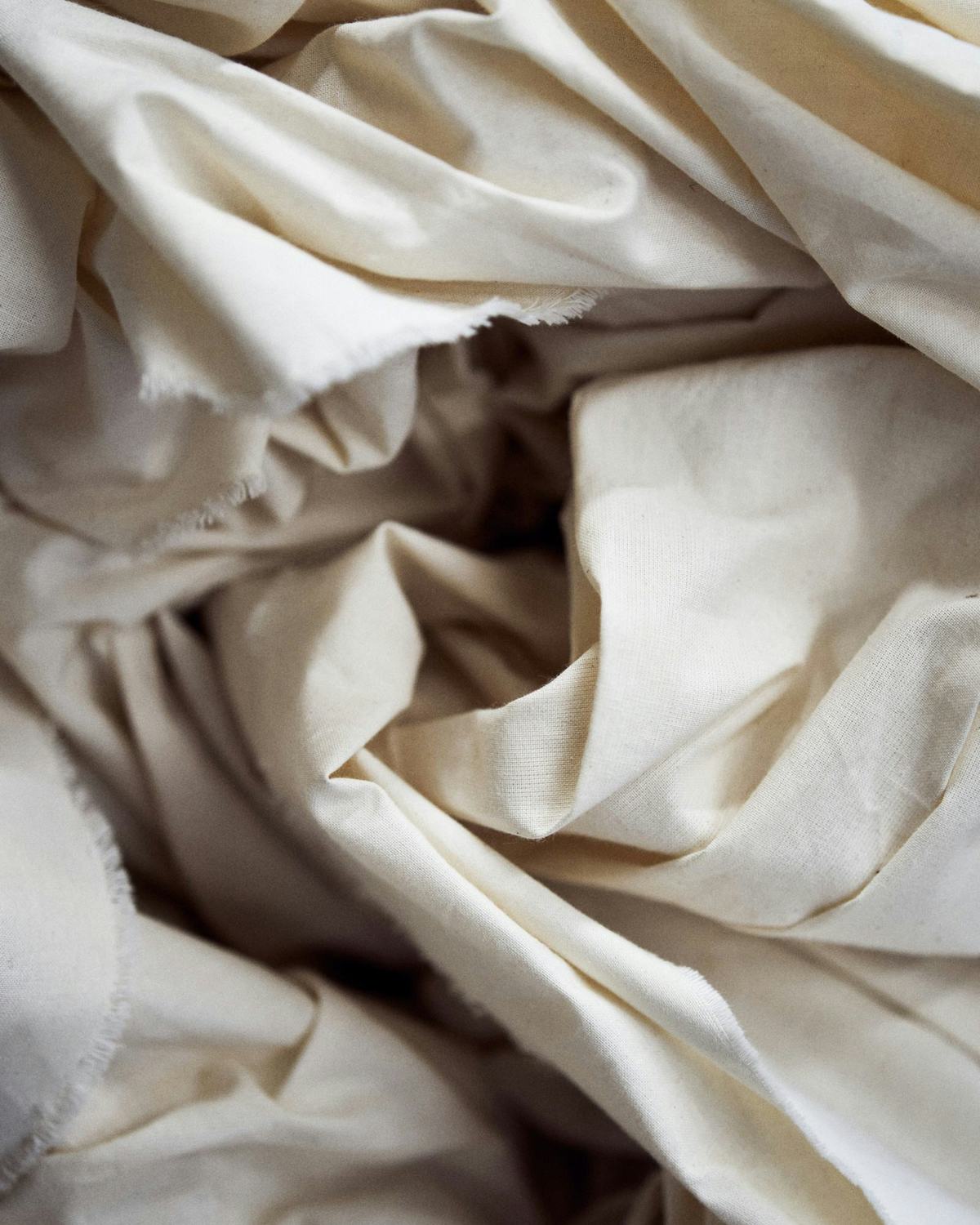 Rumpled linen duvet cover in soft natural light