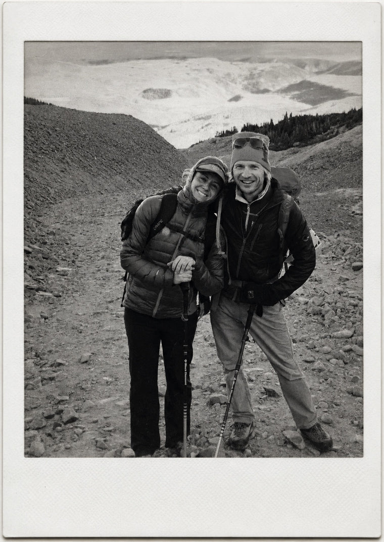 The founders on a scree trail below a glacier, in a Polaroid frame