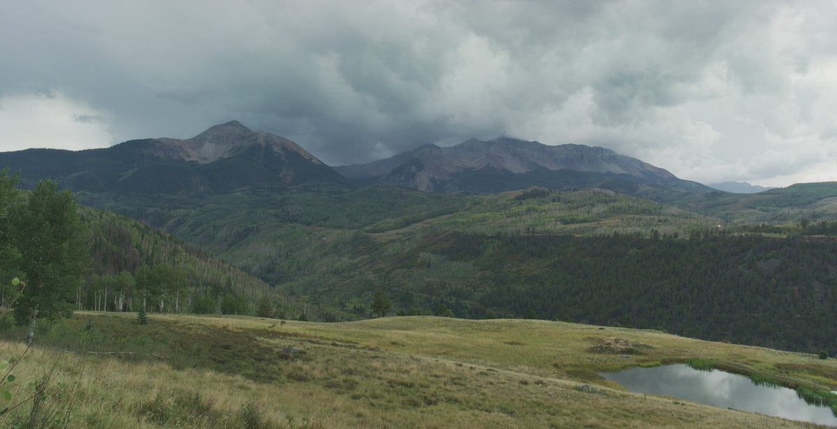 Timelapse over the Colorado Rockies, light moving across the peaks.